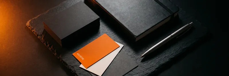 Brand identity stationery in black and orange for a Kenyan business